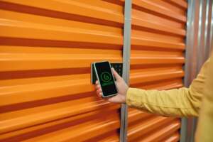 Smart lock. A warehouse worker testing the digital management system