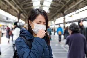 woman-feeling-sick-and-wearing-face-mask-in-metro-2023-11-27-05-05-53-utc (1)