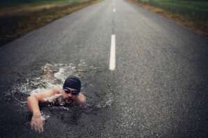 strong-man-swim-on-asphalt-road-2025-01-09-01-09-48-utc (1)