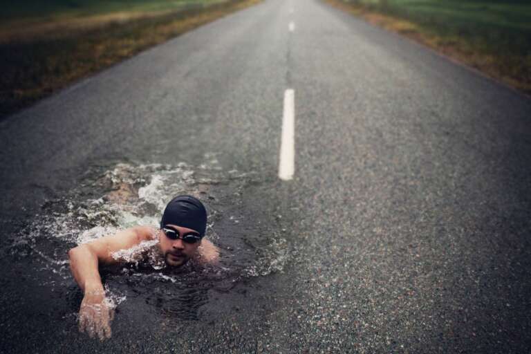 strong-man-swim-on-asphalt-road-2025-01-09-01-09-48-utc (1)