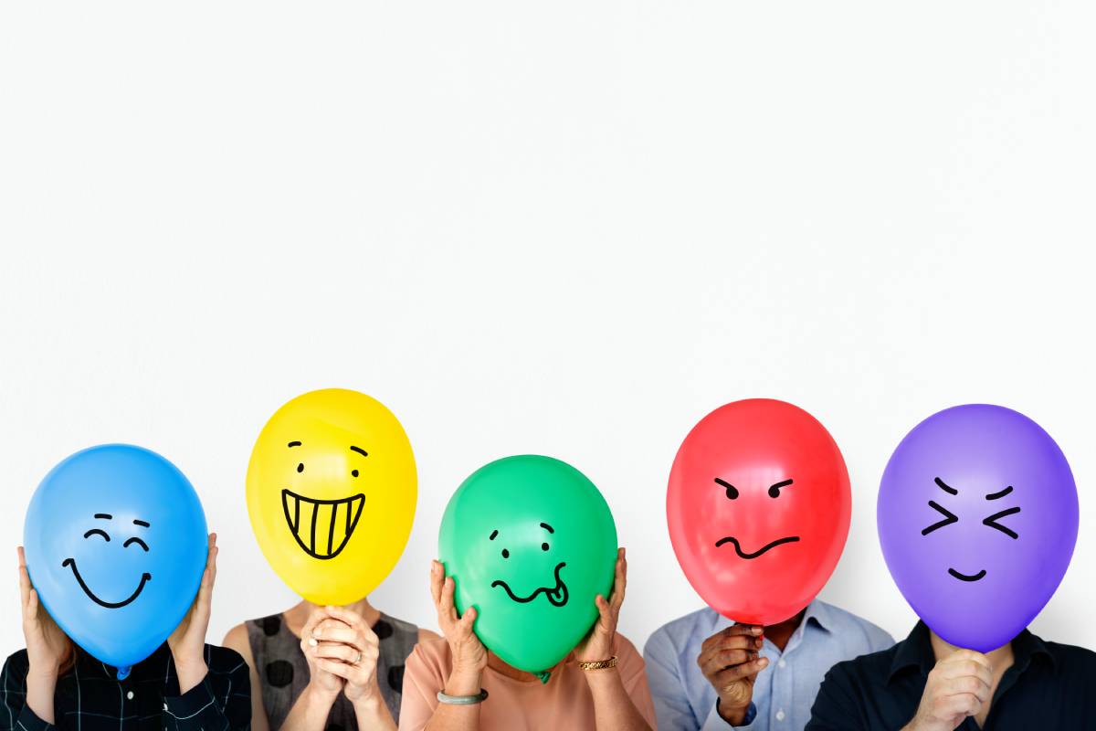 Group of people holding balloon express their emotion