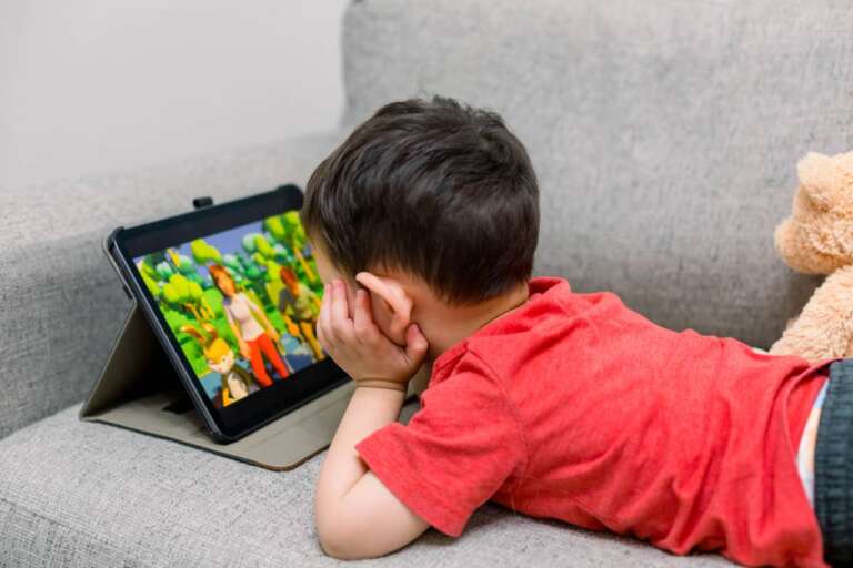 little-boy-laying-on-a-couch-watching-shows-on-you-2025-01-08-22-59-54-utc (1)